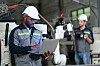 Male automation engineer checking and inspection control a robot arm welding machine with laptop computer in an industrial factory.Artificial intelligence concept.