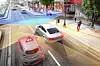 Autos mit Sensoren fahren auf einer Straße und erkennen ihr Umfeld im 360-Grad-Blick.